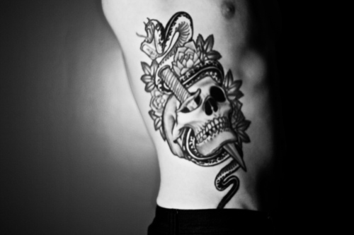 Snake And Skull Tattoo Meaning. dagger tattoo designs. Skull